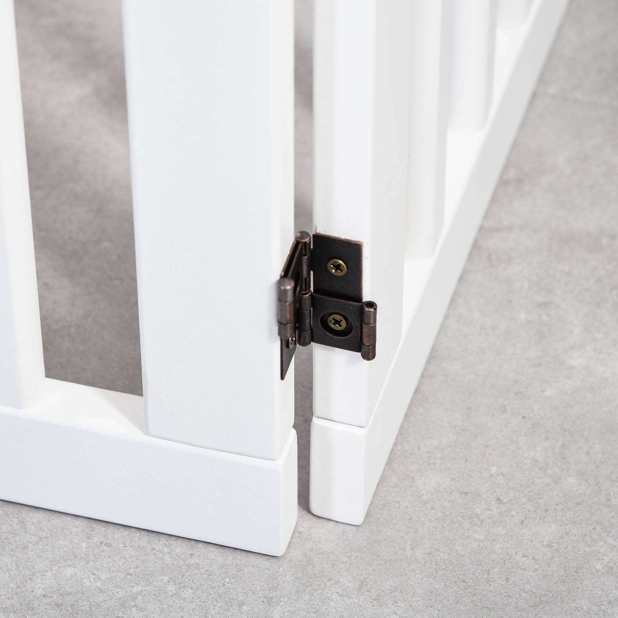 Black metal hinge with matte finish on white wooden panels of pawhut foldable freestanding pet gate for dogs