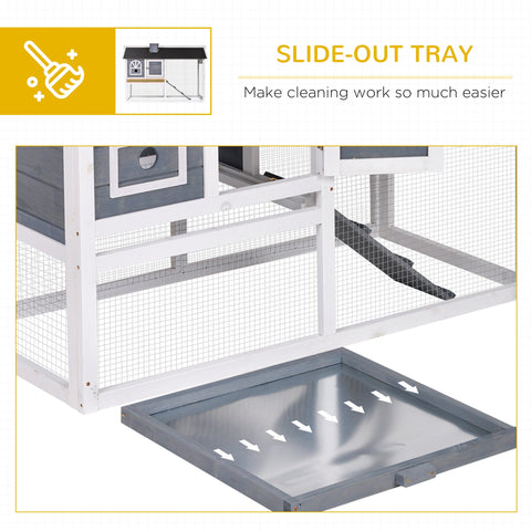 Gray slide-out tray with smooth surface and white arrows showing easy access in pawhut wooden rabbit hutch run box size
