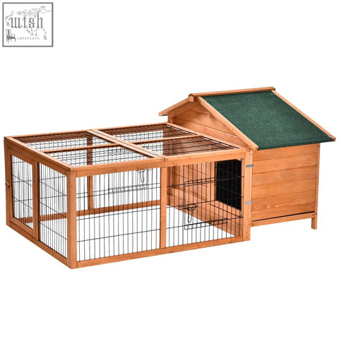 Wooden rabbit hutch with green roof and black metal wire panels featuring an enclosed main house and openable run