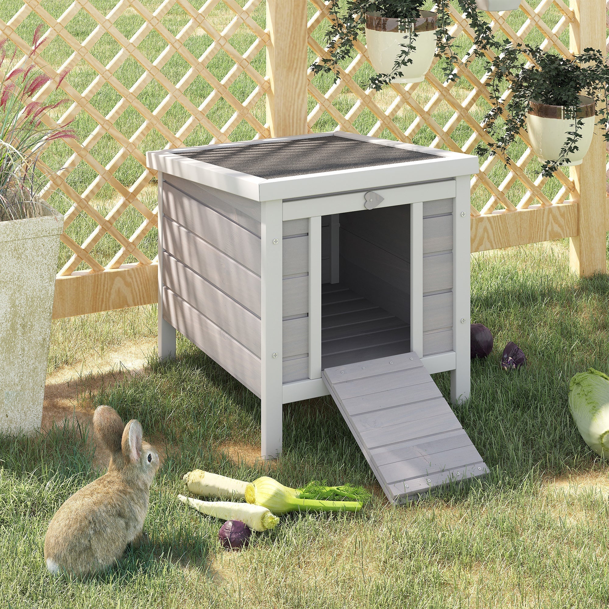 Gray wooden rabbit hutch with asphalt roof and slanted door ramp for outdoor guinea pig or bunny house