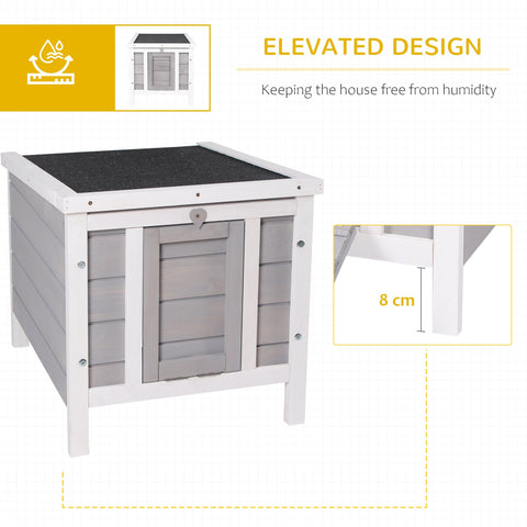 White and gray wooden rabbit hutch with asphalt roof and door ramp for small pets like guinea pigs and bunnies