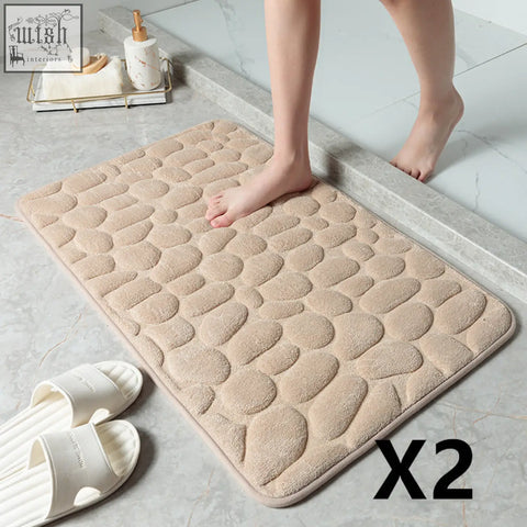 Beige pebble textured floor mat with soft memory foam material offering great water absorption and plush comfort