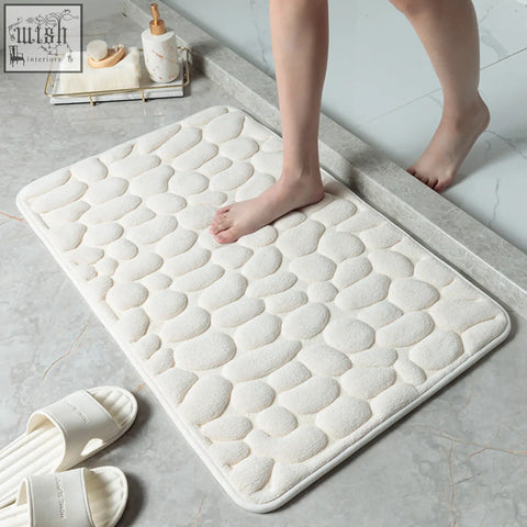 White pebble stone bathroom floor mat with textured memory foam and water absorption for toilet or door use