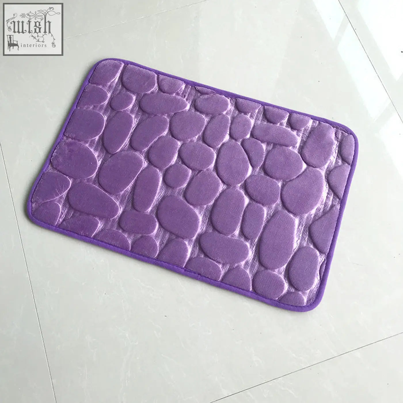 Purple pebble stone bathroom floor mat with soft plush memory foam and textured water absorption surface
