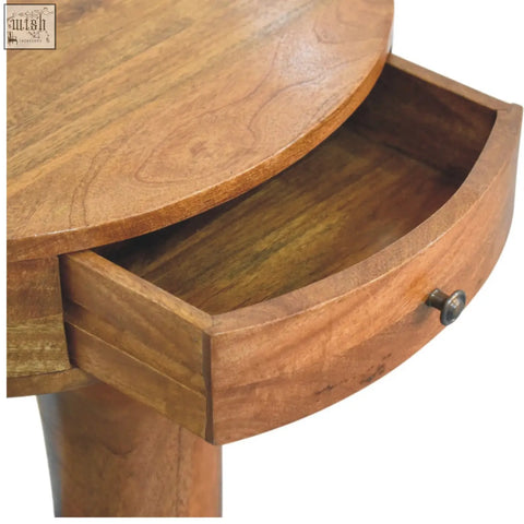Warm-toned wooden pedestal curved bedside table with round top drawer and metal knob for bedroom use