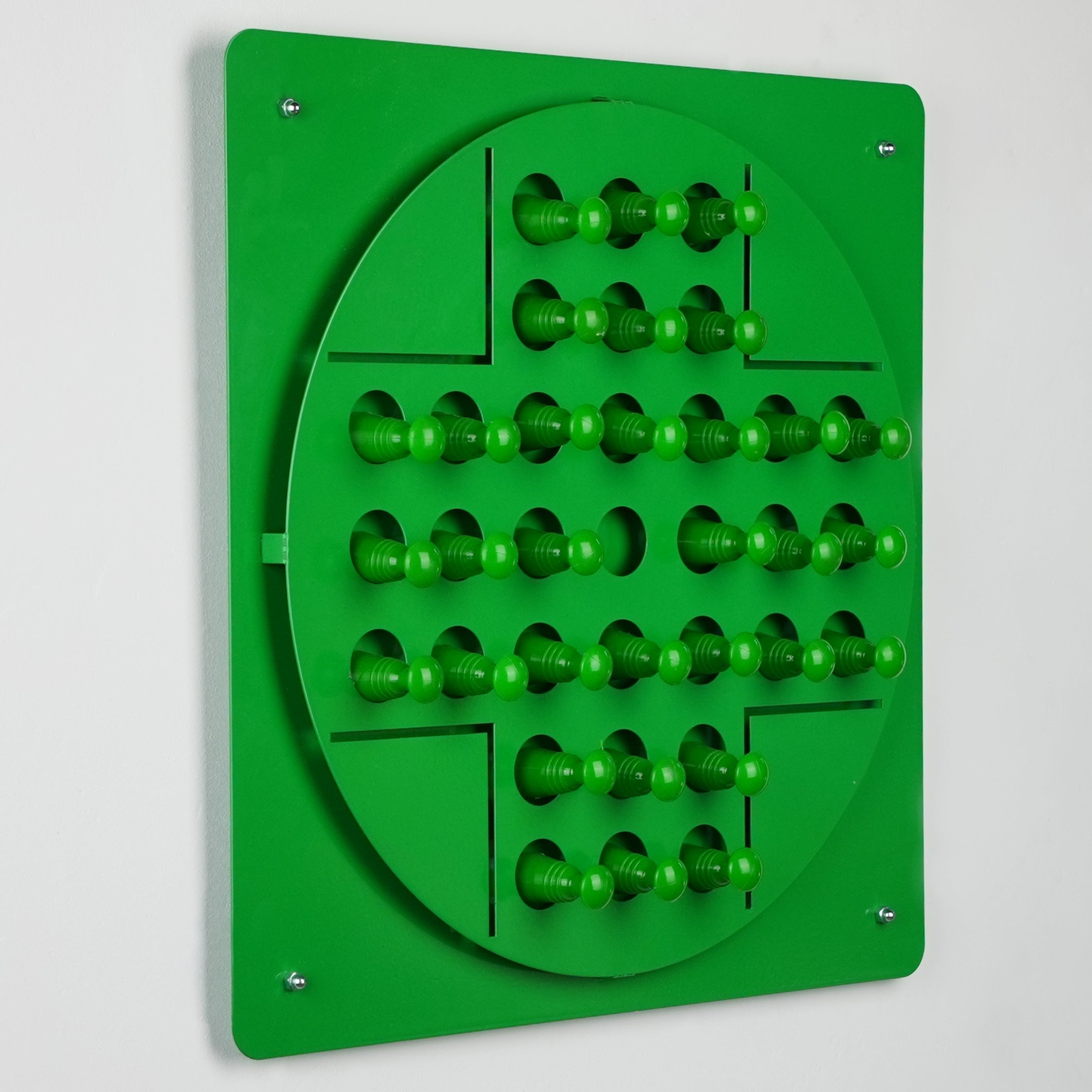 Green plastic peg solitaire board featuring rows of vibrant green pegs showcasing color options for sensory play