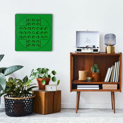Green peg solitaire wall art with vibrant hues featuring a circular pattern of raised spheres and color options