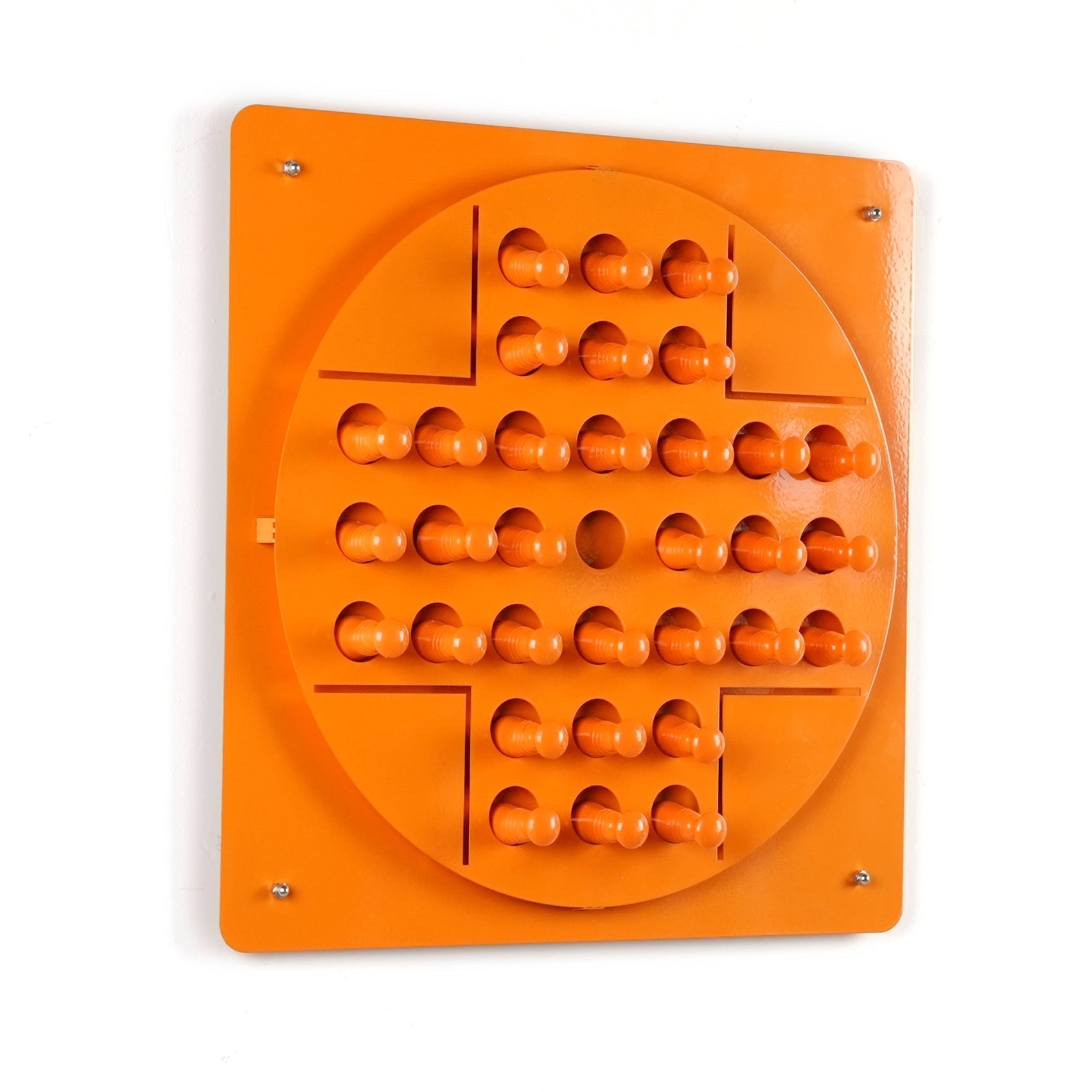 Bright orange wooden peg solitaire board with rounded pegs in a circle for solo test and hanging instructions