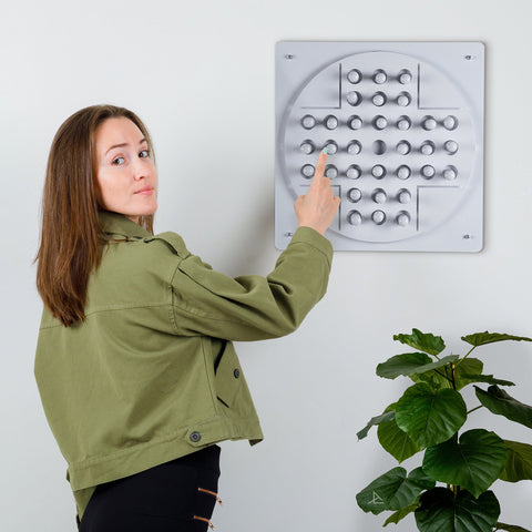 Gray square peg solitaire tactile sensory board with raised button grid for solo test and age range play