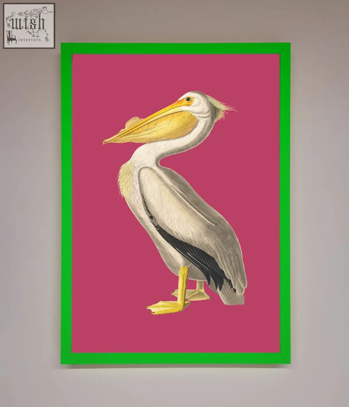 A pink framed poster of a pelican with detailed white feathers black wingtips and yellow beak on a vibrant pink background
