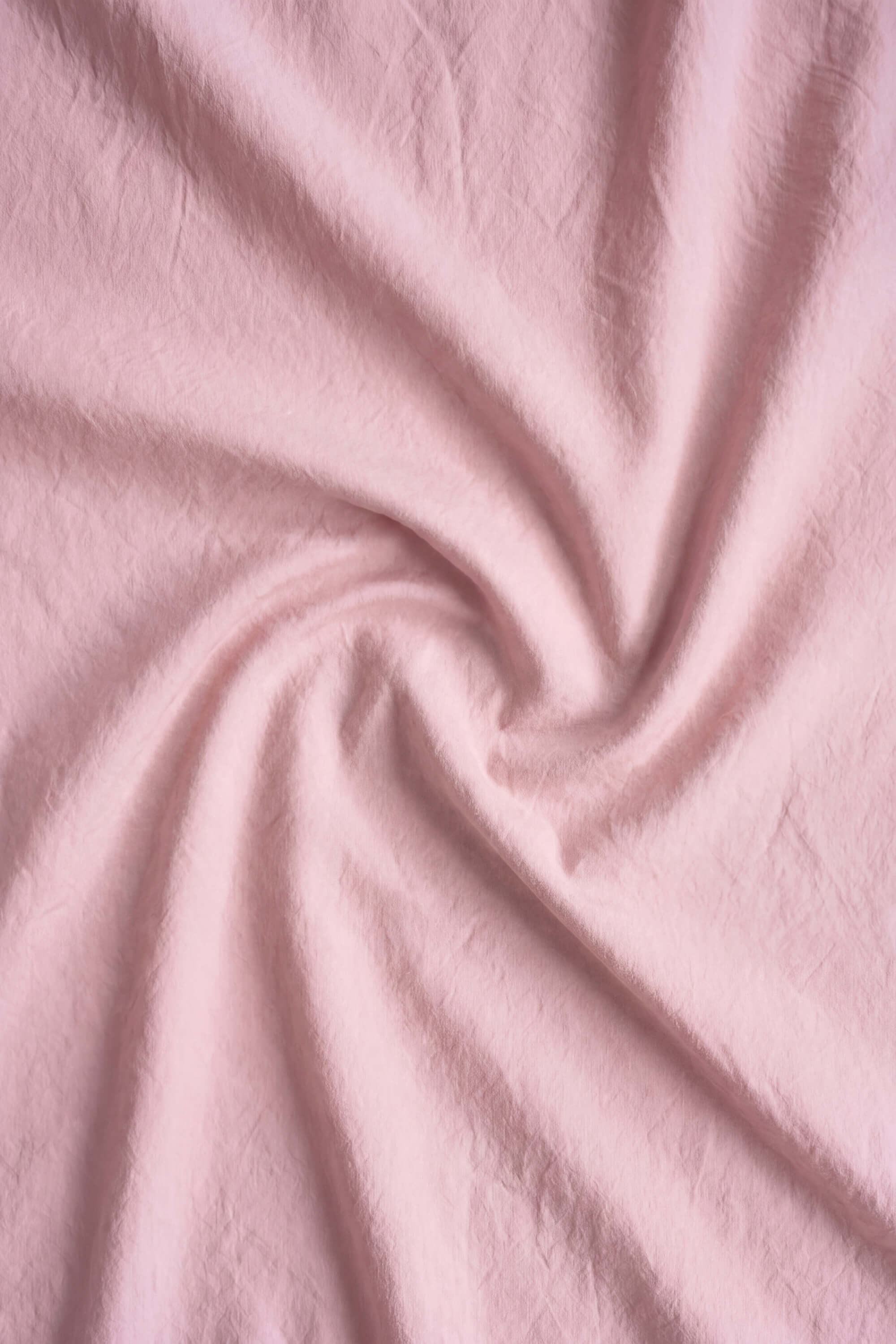 Soft pink cotton percale essentials bedding set featuring a gentle textured weave for cozy comfort
