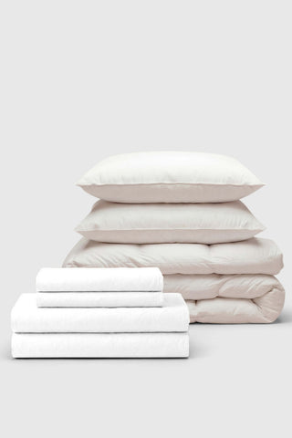 White cotton percale bedding set with matching pillows and quilted duvet perfect for move-in use