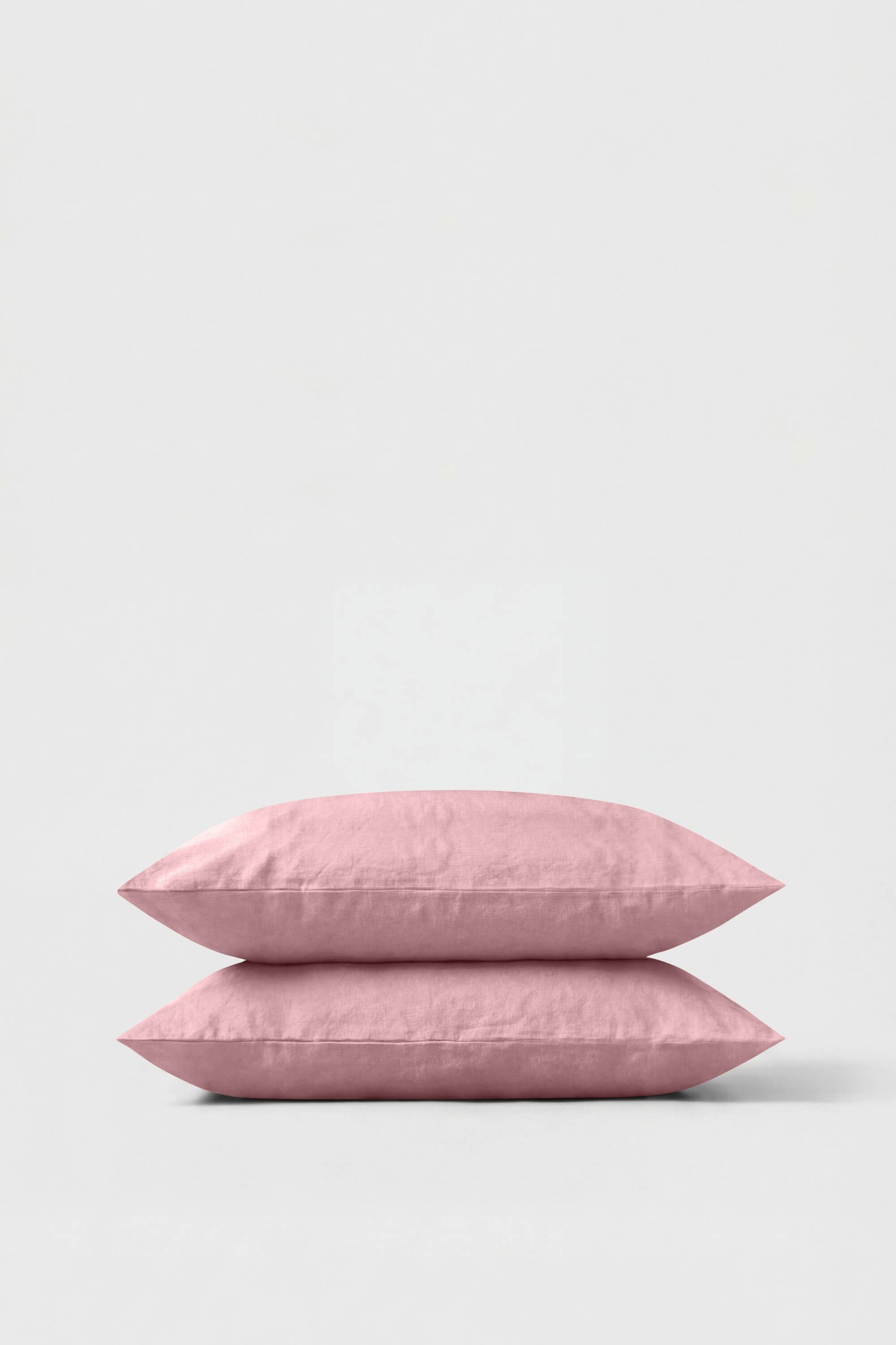 Pair of soft blush pink percale pillowcases with subtle textured fabric finish perfect pillowcase pair