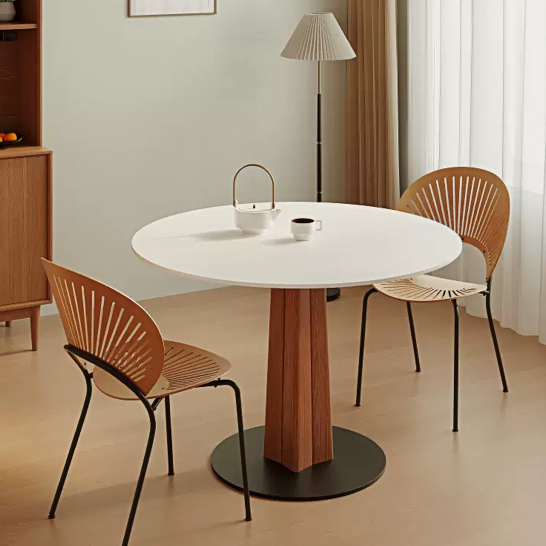 Percival white round dining table with a wooden pedestal base and black circular foot perfect for white round dining rooms