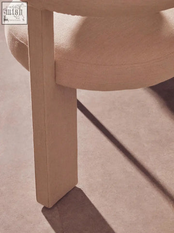 Beige upholstered perdoba cream texture linen dining chair with minimalist design and wooden legs