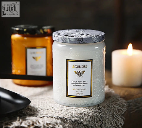 White textured glass scented candle with silver and black lid embossed bee design perfect as a scented candles gift
