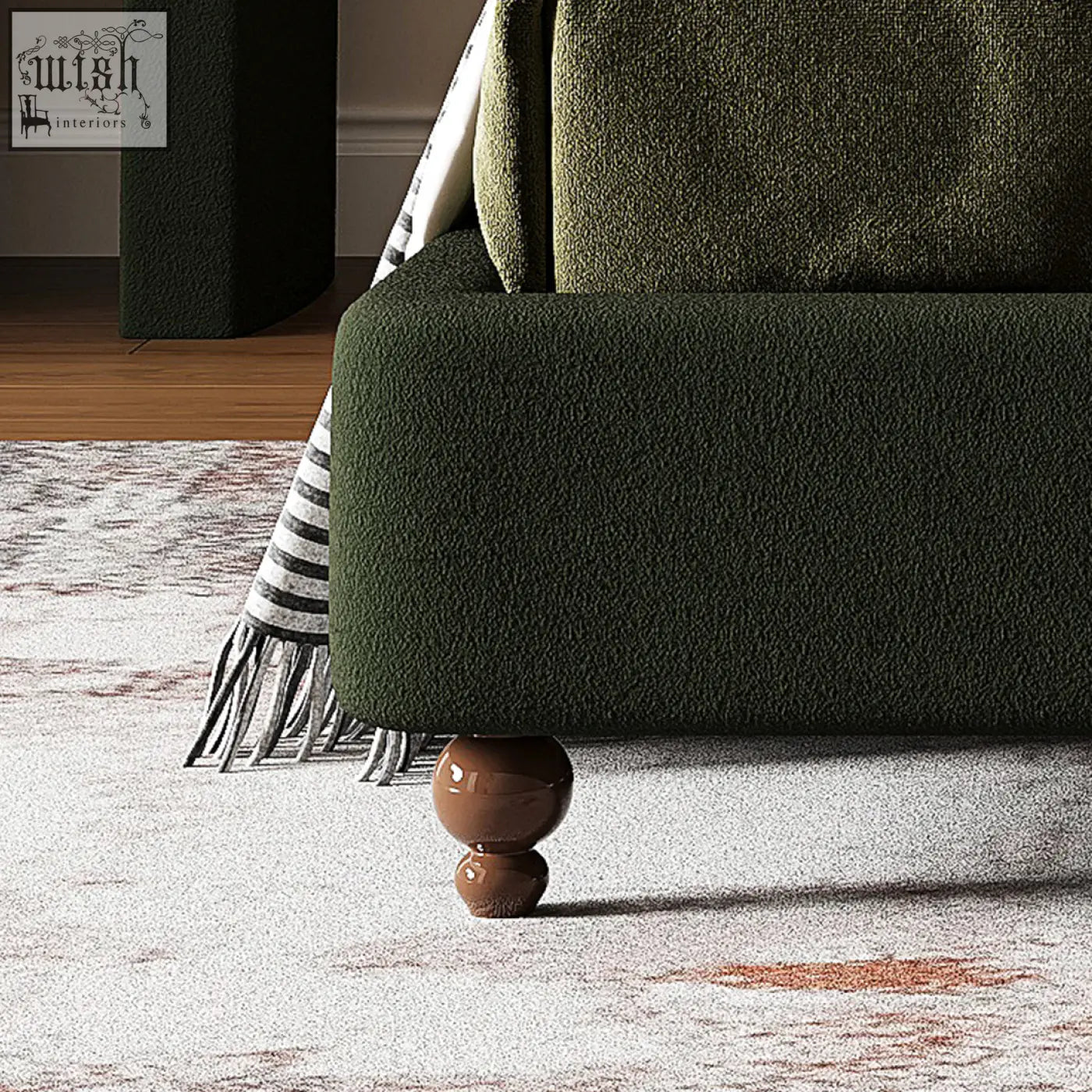 Dark green velvet sofa leg with glossy brown spherical finials on a persephone shell double king size bed