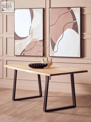 Light wood mango wood live edge dining table with black metal legs perfect for stylish dining spaces