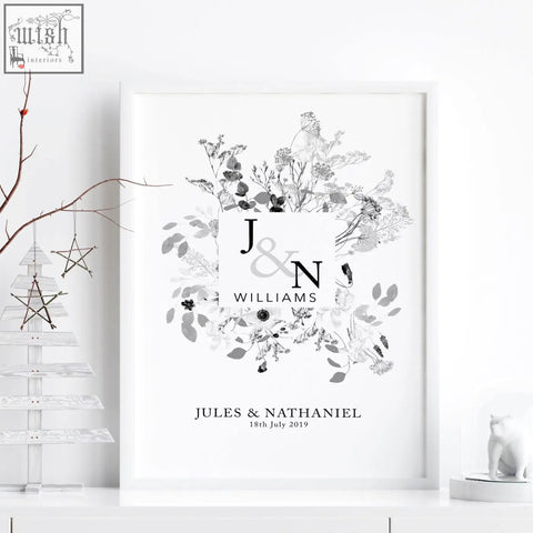 Minimalist black and white framed wall art print with monogram and floral design for personalised wedding anniversary gifts