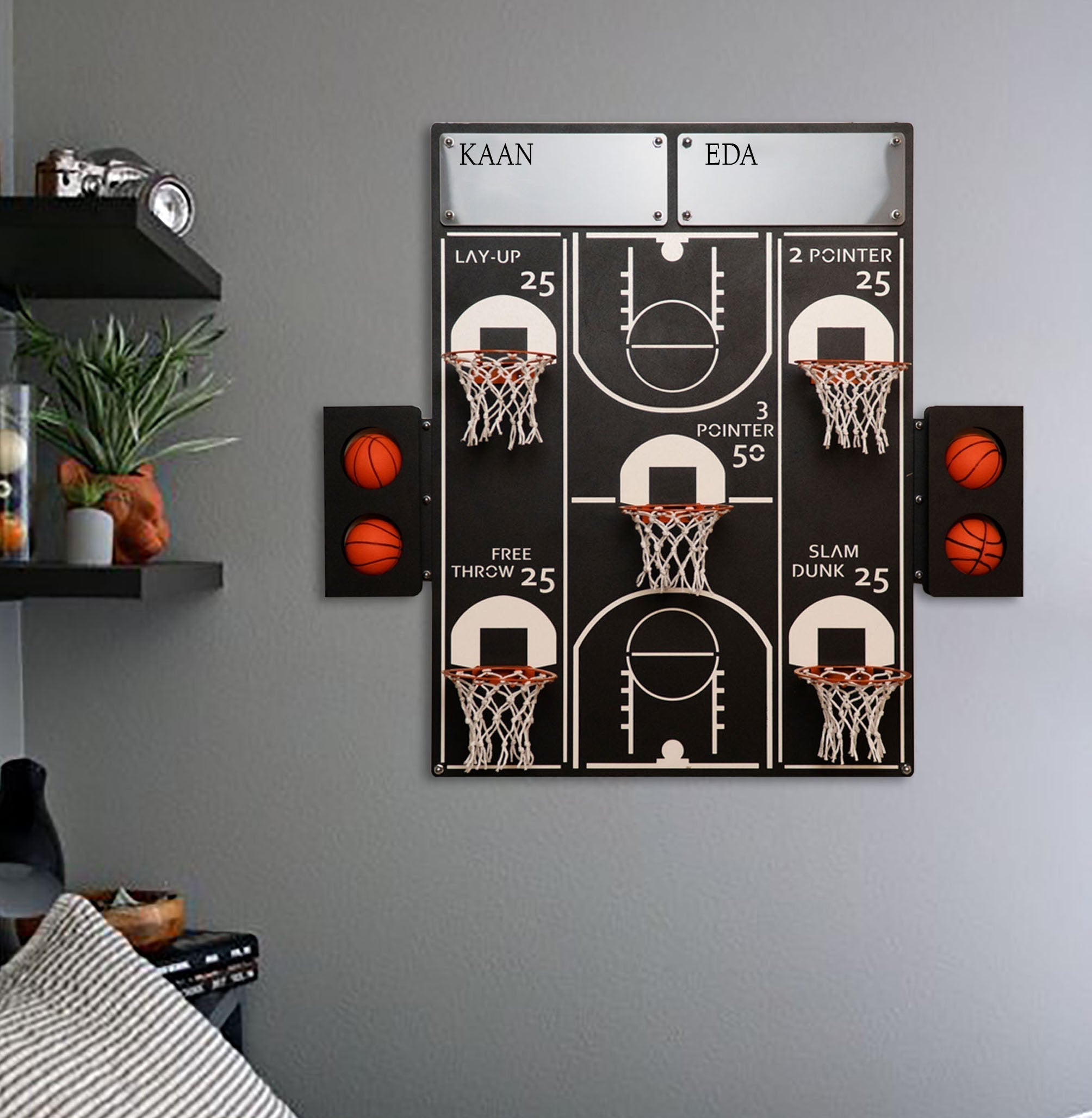 Black and white basketball wall game with four 25 point hoops and orange balls in traffic light holders on both sides