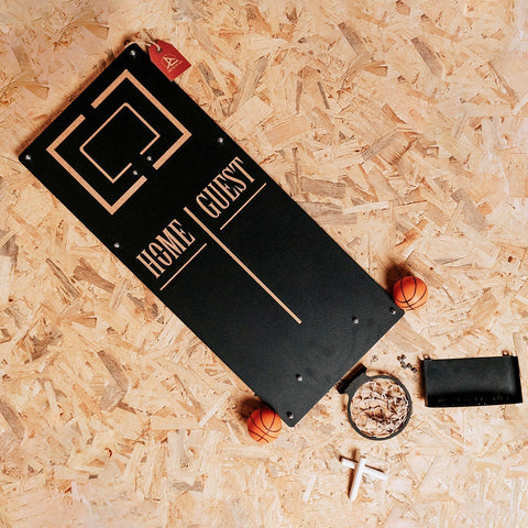 Personalized basketball wall game with black rectangular board and gold geometric design featuring home guest text