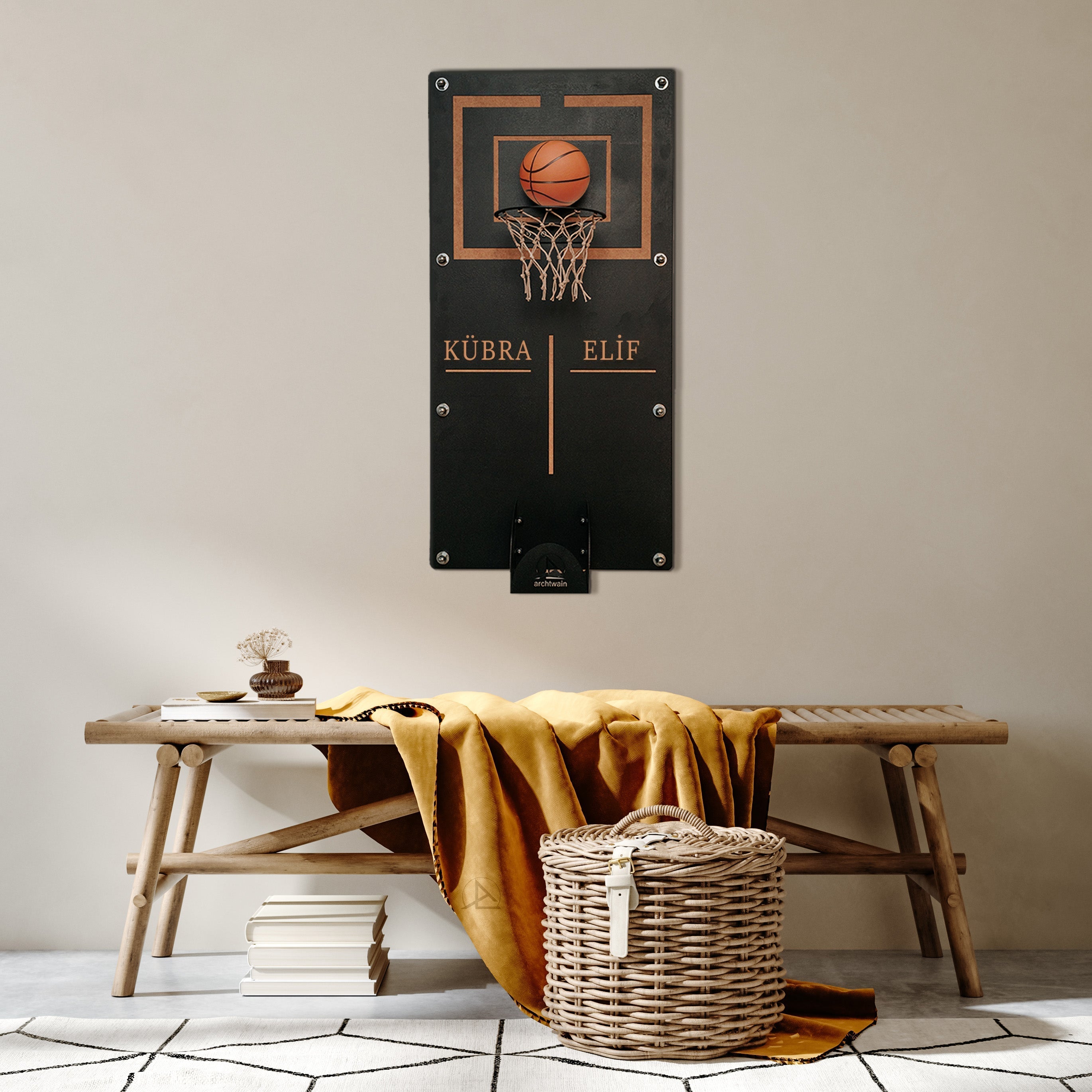 Black metal wall-mounted mega basketball hoop with brown leather ball and personalized gold lettering kübra and elif