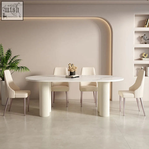 White marble oval dining table with fluted legs paired with cream peru dining chair for stylish peru dining setup