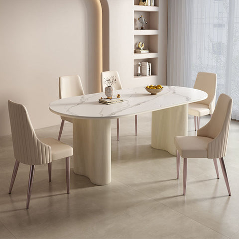 Modern peru dining table with white marble oval top and cream ribbed pedestal legs perfect for dining table setup