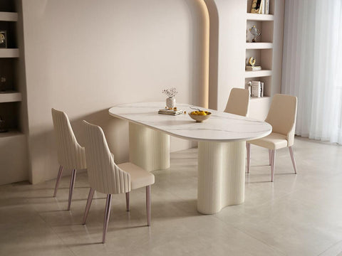 Modern peru dining table with white marble oval top and cream vertically ribbed pedestal legs for stylish dining