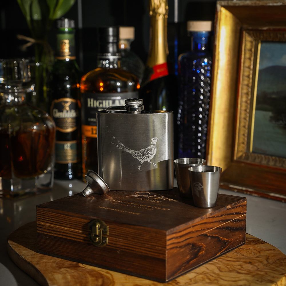 Silver stainless steel pheasant hip flask with engraved design and two matching shot glasses cup set by selbrae house