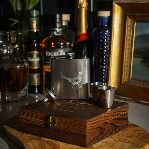 Silver stainless steel pheasant hip flask with engraved design and two matching shot glasses cup set by selbrae house