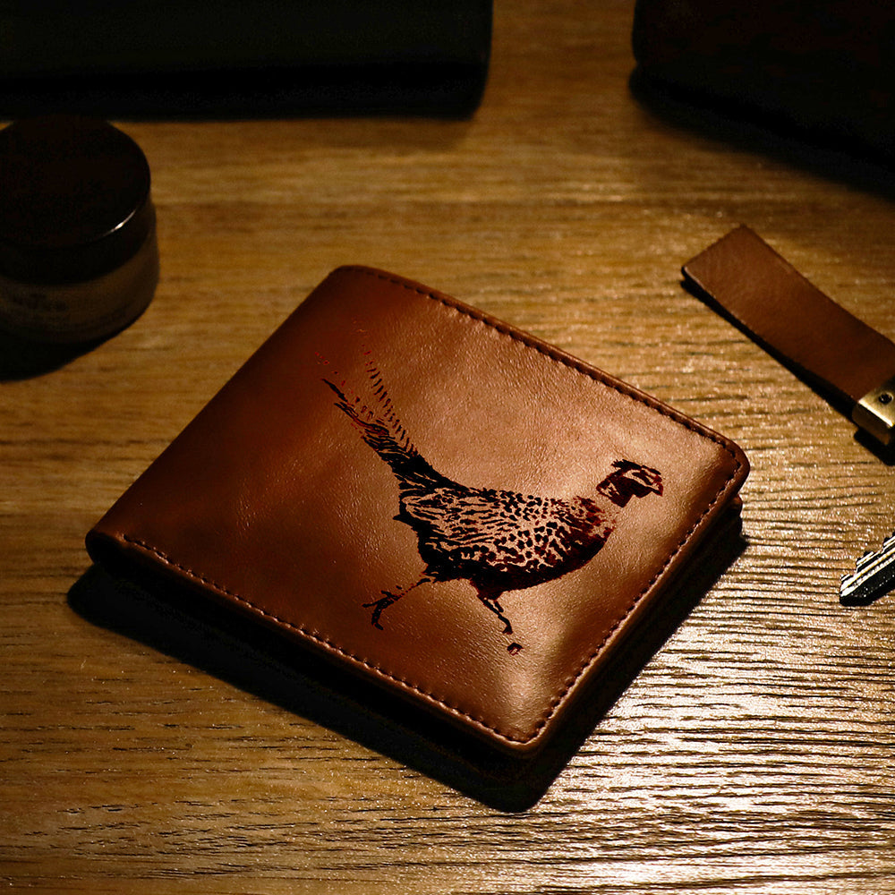 Brown leather wallet from selbrae house with an intricately engraved pheasant design perfect for everyday use