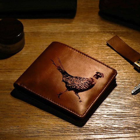 Brown leather wallet from selbrae house with an intricately engraved pheasant design perfect for everyday use