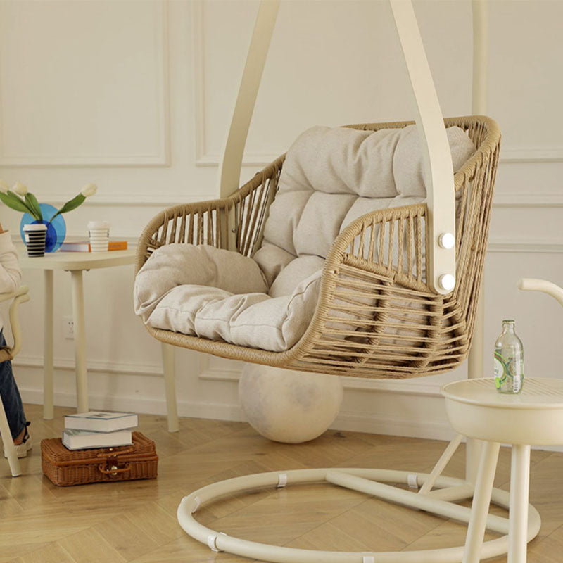 Beige woven phedra rattan garden hanging egg chair with plush cushioned seat and back for indoor outdoor use