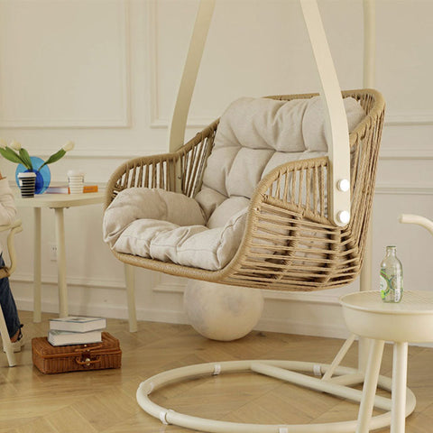 Beige woven phedra rattan garden hanging egg chair with plush cushioned seat and back for indoor outdoor use