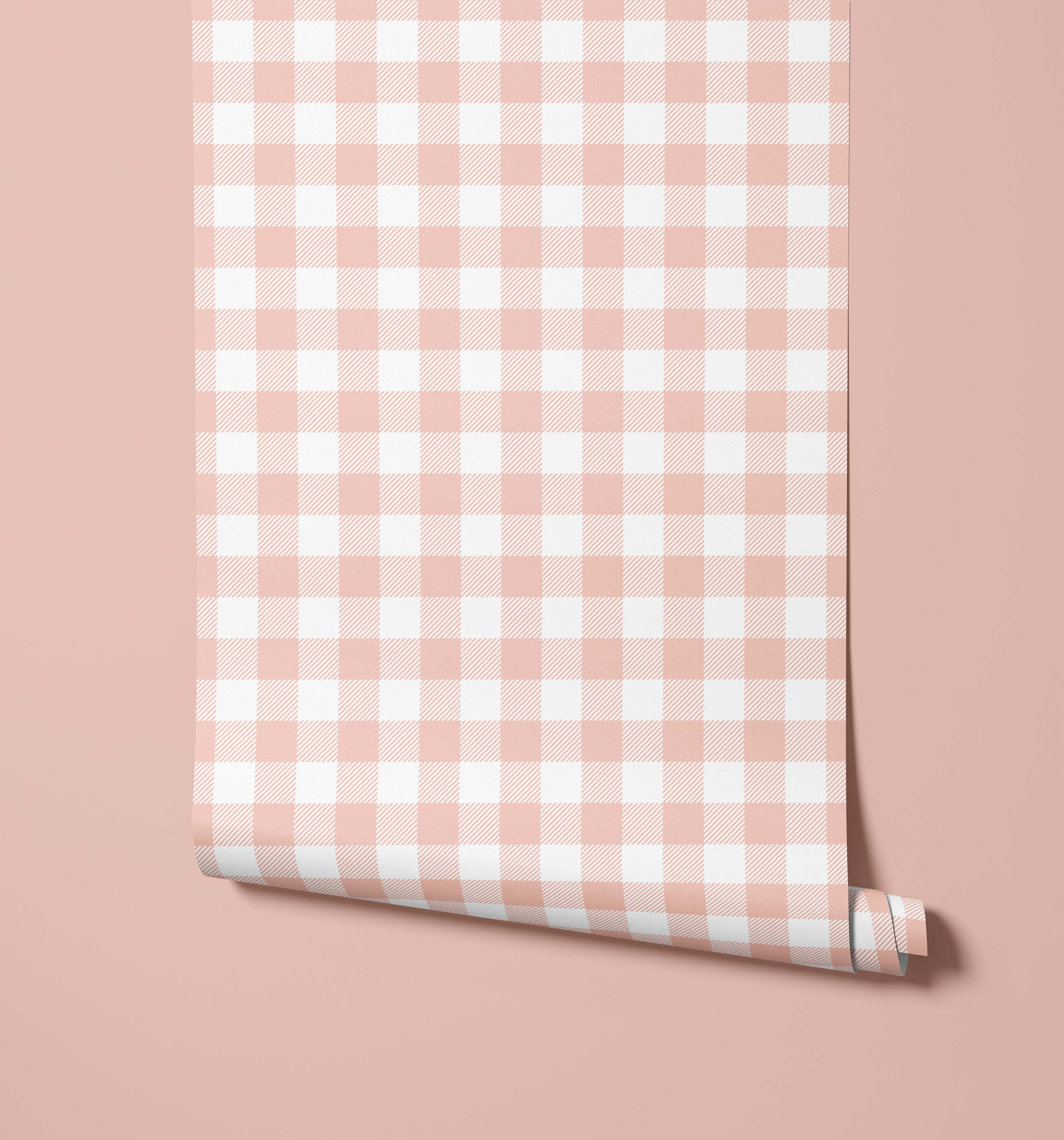 A roll of soft pink and white gingham wallpaper called picnic perfect for a cozy, playful room decor