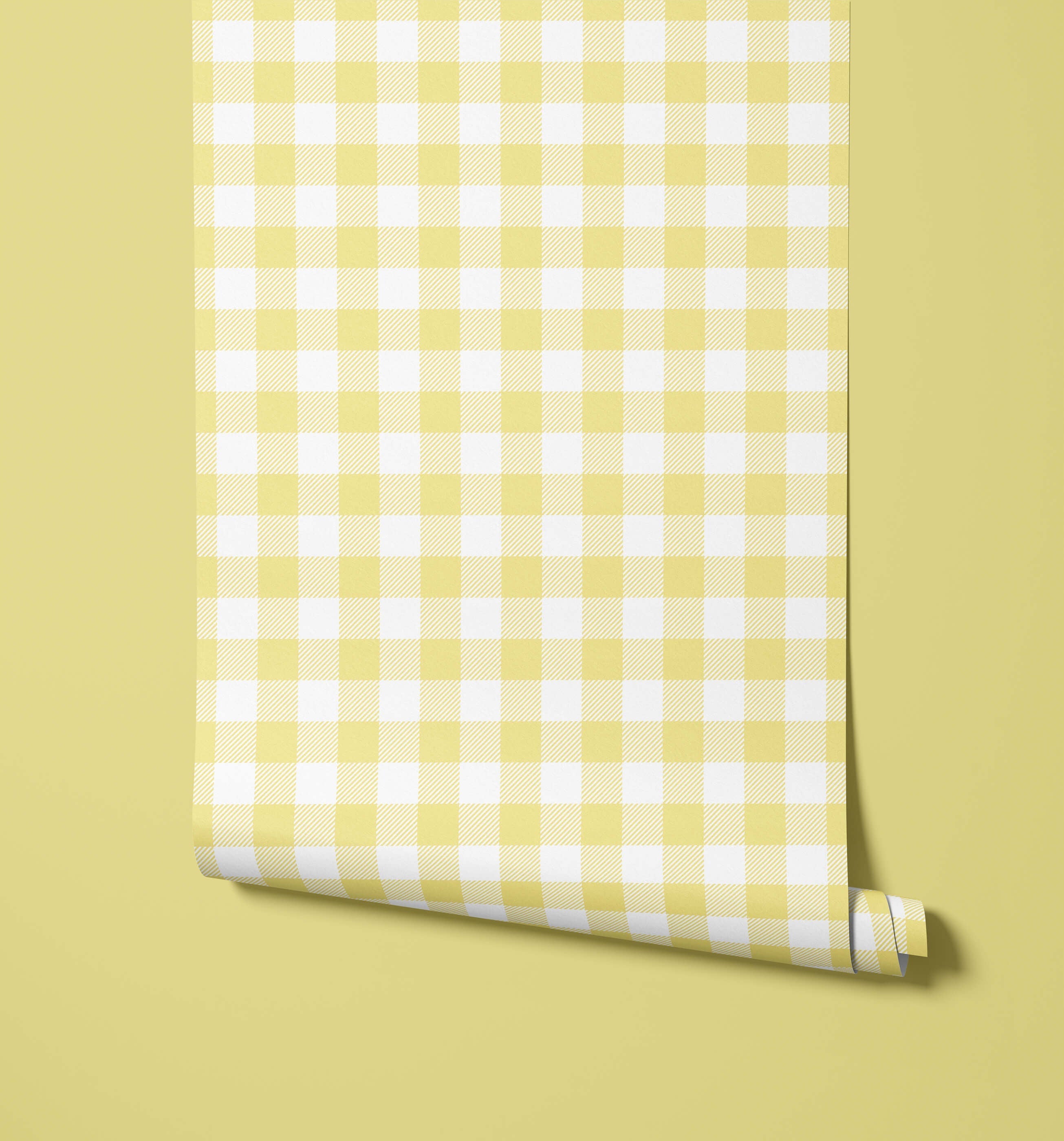 A roll of pale yellow and white gingham wallpaper from the picnic collection perfect for cheerful wall decor