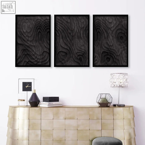 Three black framed 3d wood relief wall art pieces with swirling brown texture perfect for living room wall art prints