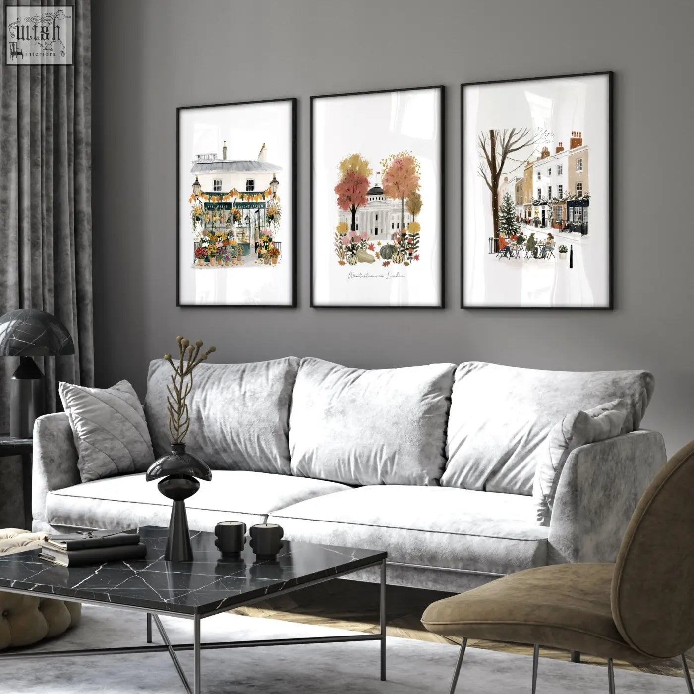 Gray velvet sofa with matching pillows and black marble coffee table in a wall living room with london travel art prints