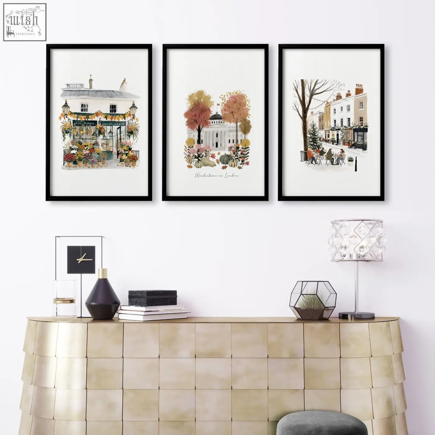 Three black-framed london watercolor prints above a gold console table perfect for wall living room decor