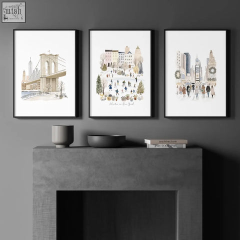 Three black framed watercolor travel wall art prints with white matting showing winter in new york city scenes