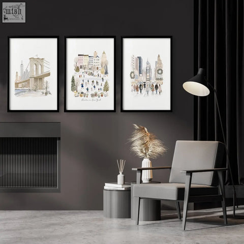 Gray upholstered armchair with dark wood frame next to winter in new york travel wall art prints set of 3 above fireplace