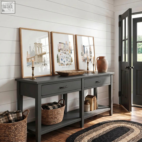 Dark gray console table with two drawers and rustic wooden top paired with winter in new york travel wall art prints