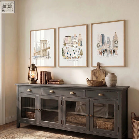 Dark gray wooden sideboard with glass-paneled doors and brass handles showcasing winter in new york travel wall art prints
