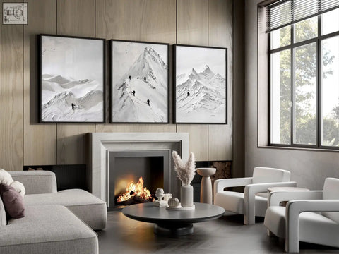 Three black-framed monochrome mountain prints hanging above a fireplace perfect for living room walls decor