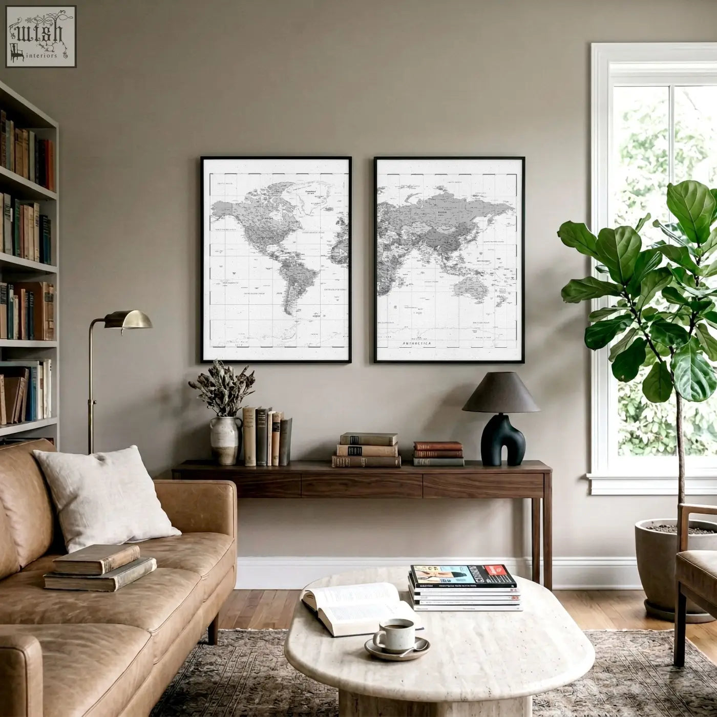 Two vintage grey world map wall art prints with black frames hanging in a living room on a neutral wall