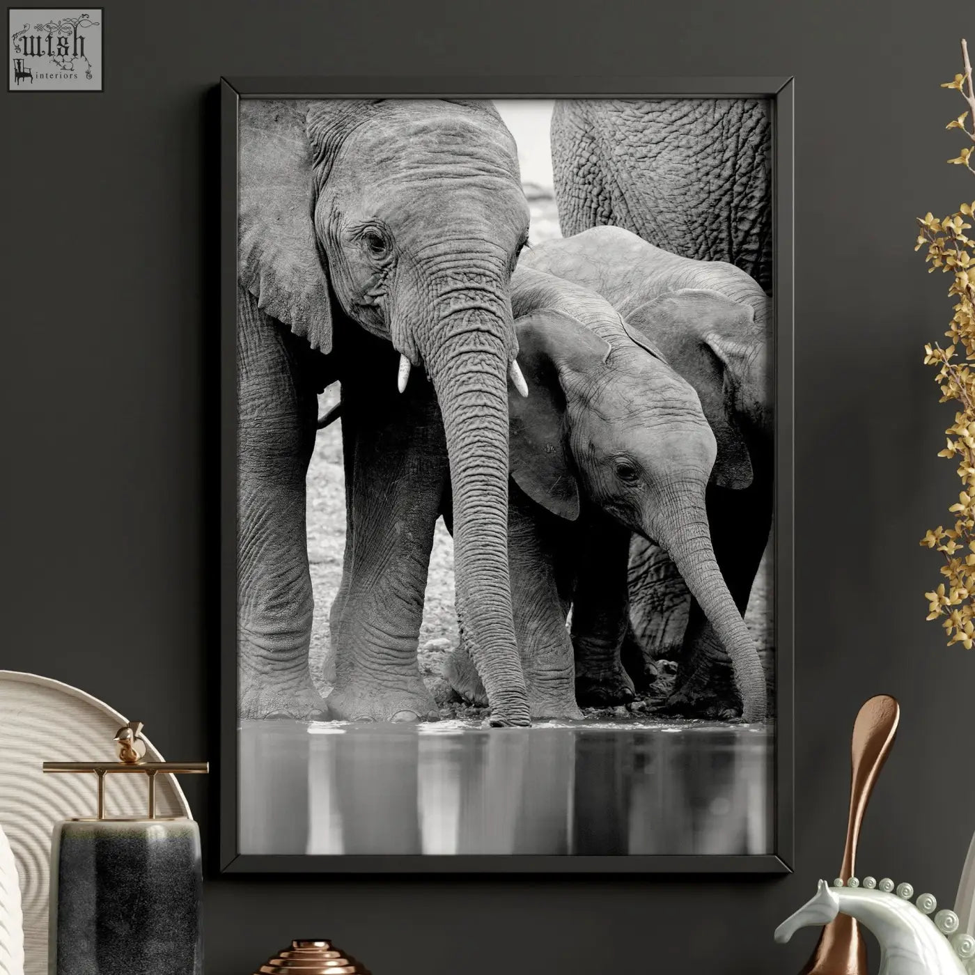 Black framed black and white wildlife safari art print of elephants at a waterhole for living room wall decor