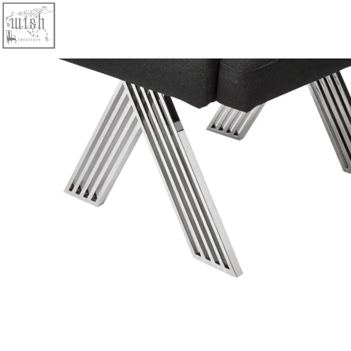 Black leather ottoman with silver legs featuring sleek chrome x-shaped design for modern black dining spaces
