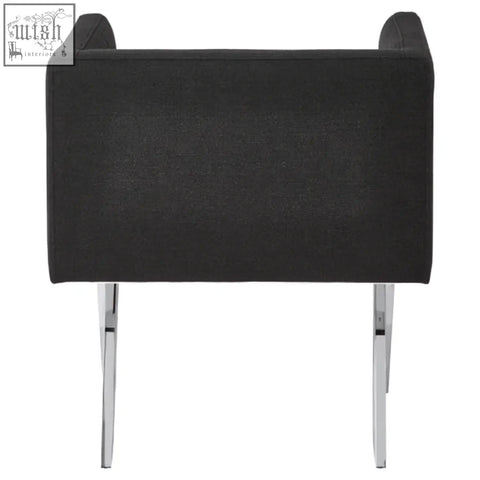 Black dining chair with soft upholstery and sleek silver legs perfect for stylish dining spaces