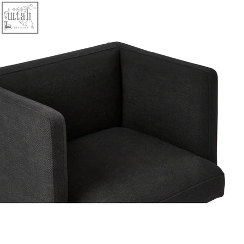 Black dining chair with black upholstered seat and silver legs for modern minimalist dining spaces